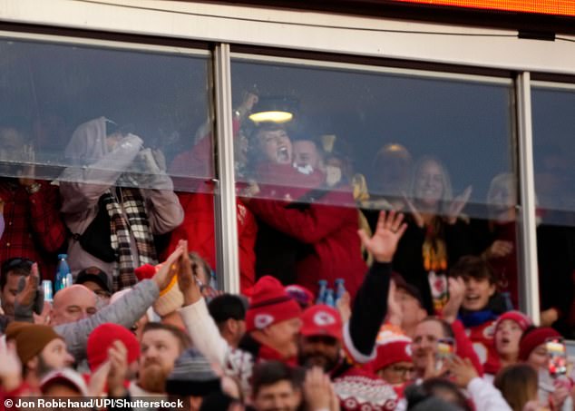 At one point she was pictured celebrating with friends while watching the action on the field unfold