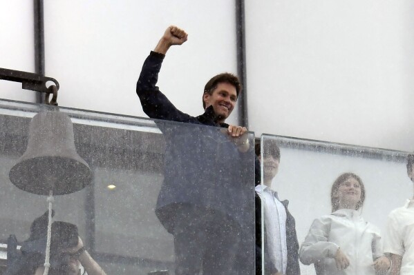 Former NFL quarterback Tom Brady, center, gestures from the lighthouse at Gillette Stadium prior to an NFL football game between the Philadelphia Eagles and the New England Patriots, Sunday, Sept. 10, 2023, in Foxborough, Mass. (AP Photo/Mark Stockwell)