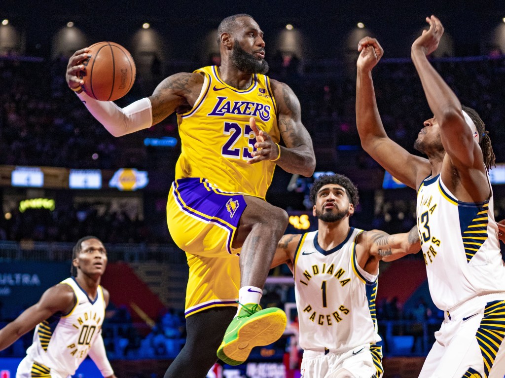 LeBron James, who was named the MVP of the NBA Cup, looks to make a pass during the Lakers' victory.